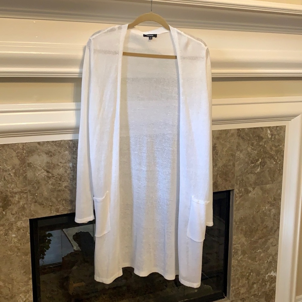 Stylish white knee length sweater.